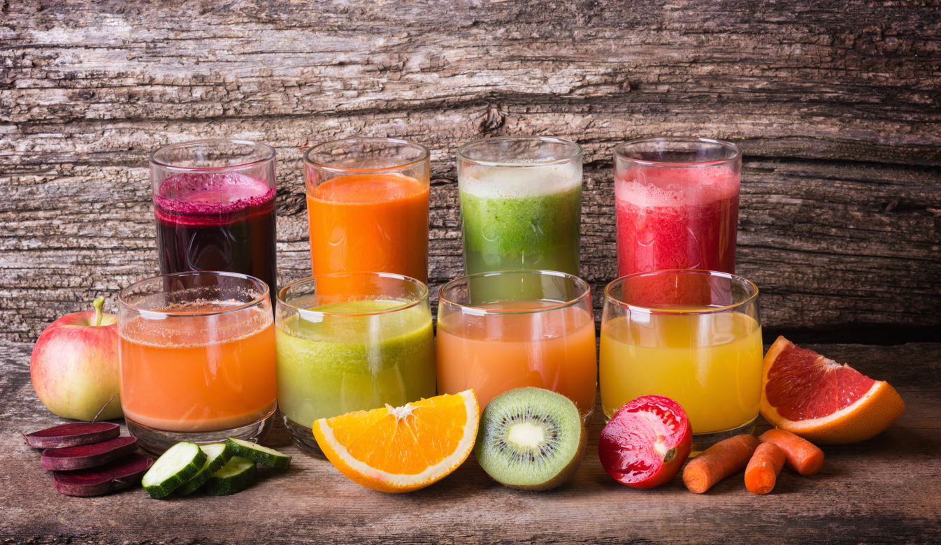 Healthy fruit & vegetable juice on wooden background